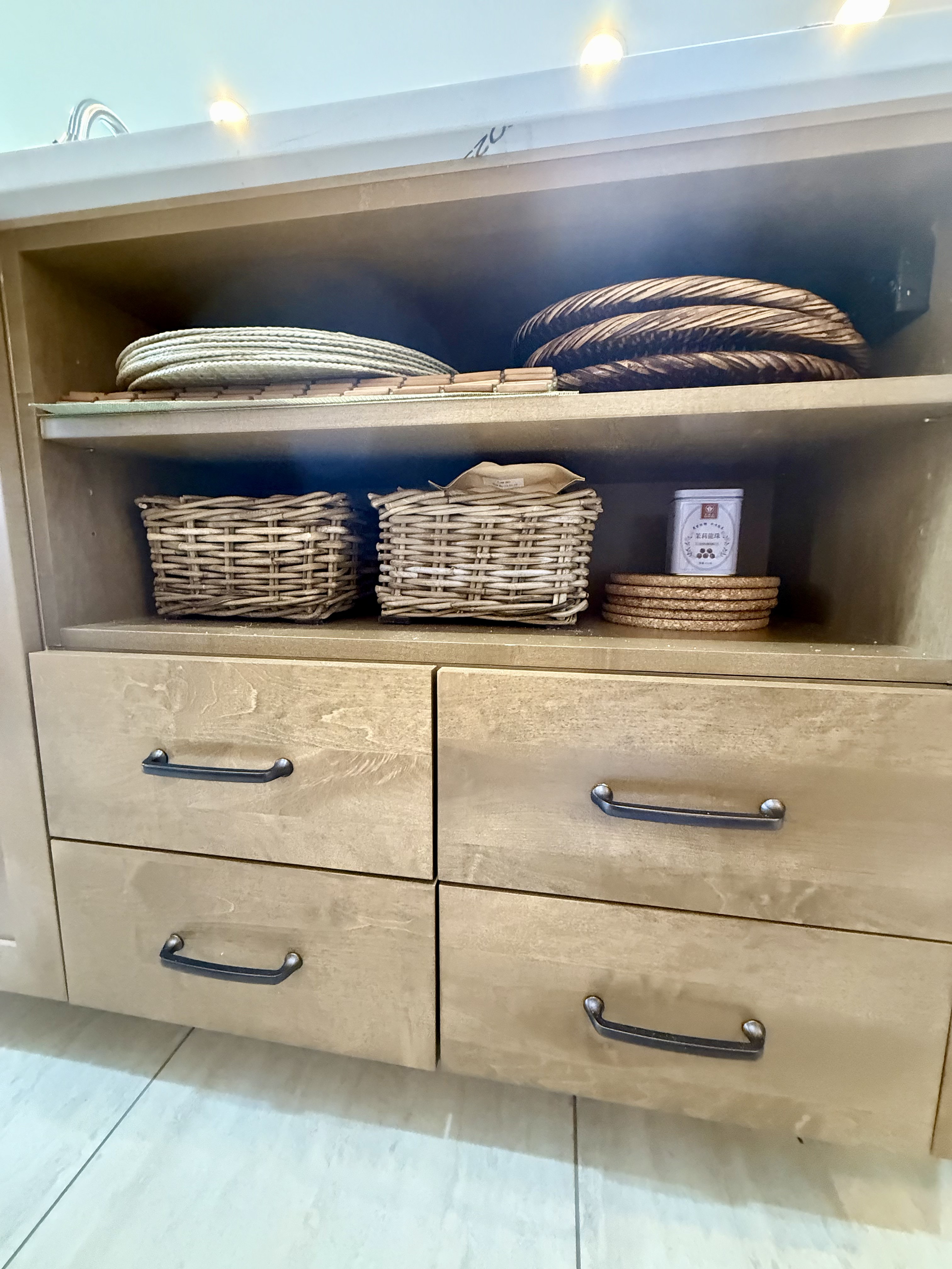 Custom maple slab drawer fronts with integrated finger-pull detail