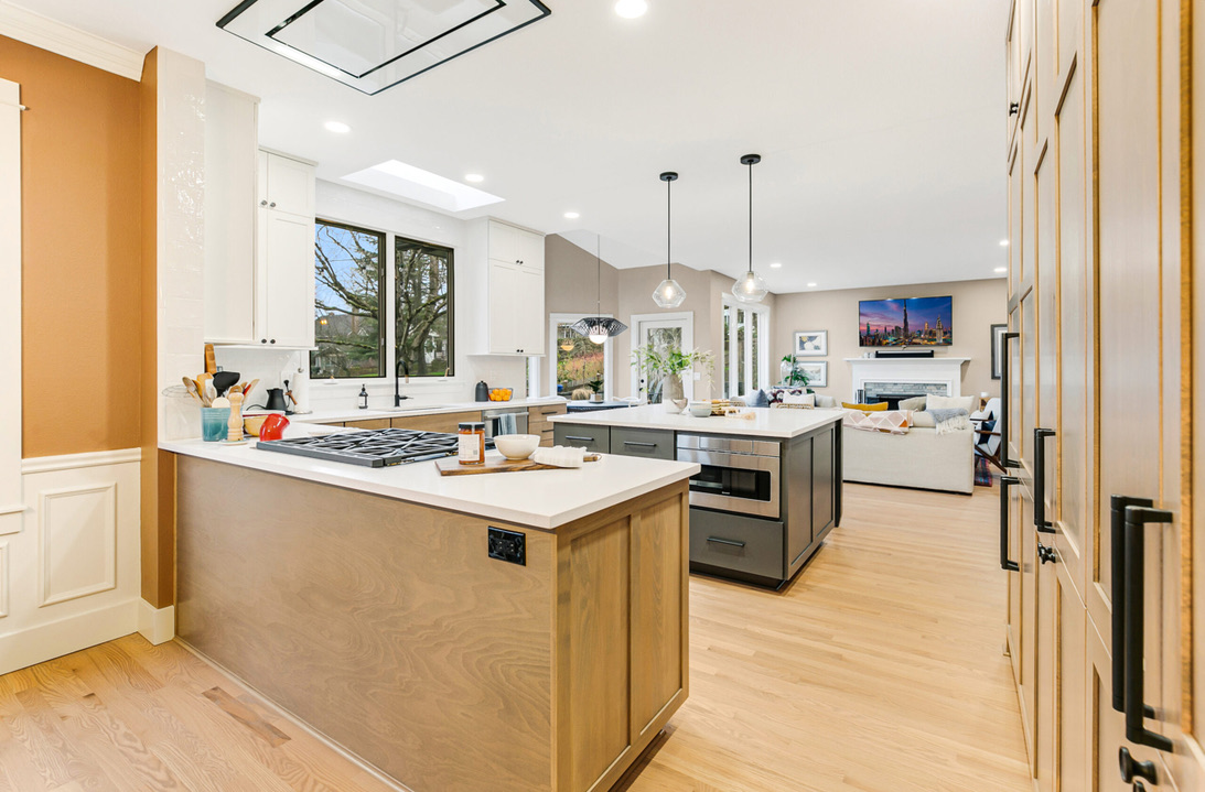 Kitchen island with beech shaker cabinets and marble waterfall countertop detail