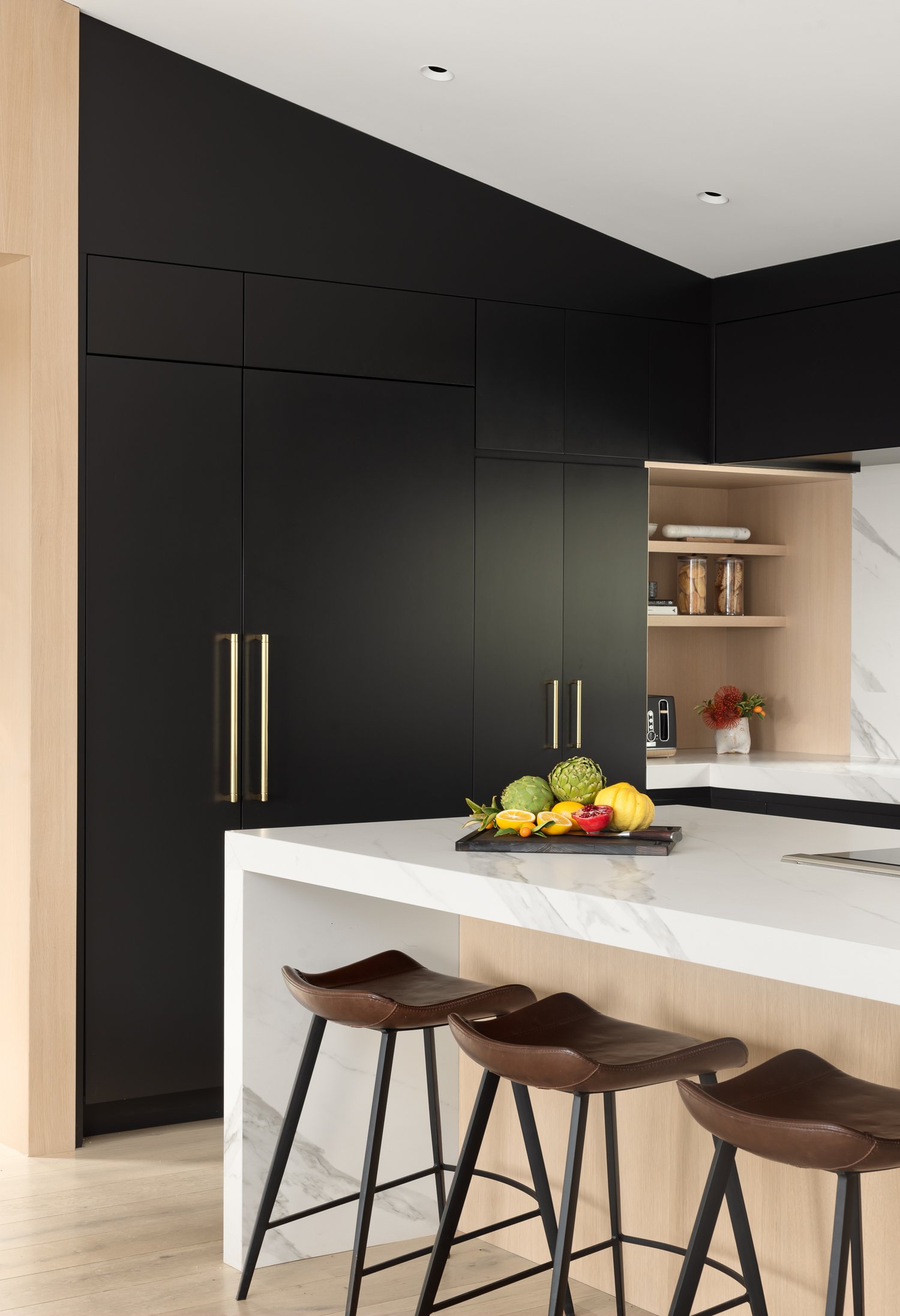 Integrated finger-pull slab drawers with soft-close mechanisms in modern kitchen