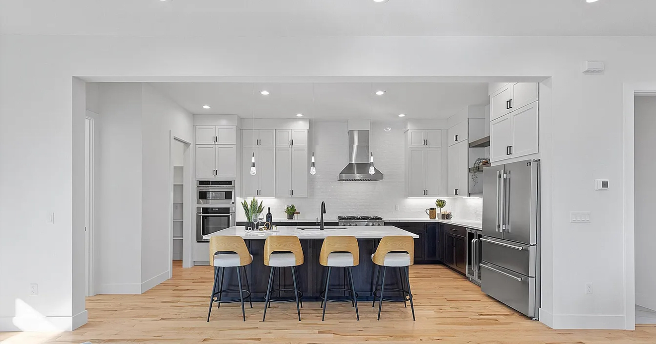 Oil-rubbed bronze hardware on dark-stained beech shaker cabinet doors with soapstone countertop