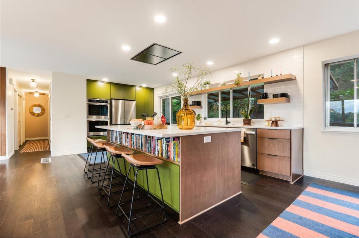 Open-concept retro modern kitchen showcasing hybrid framed and frameless cabinet construction